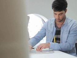 Male Fashion Designer working in studio Stock Footage
