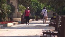 Valletta cathedral and people walking News Clip
