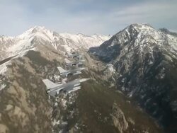 TS 4 F-16 fighter jets flying in formation in front mountains, Colorado Rockies, Colorado, USA Stock Footage