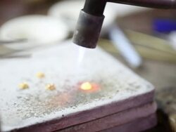 Goldsmith Jeweller decorating gold Stock Footage