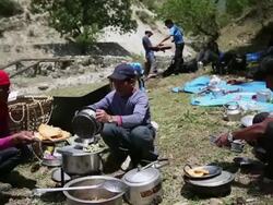 MS POV Men cooking at camp at Himalaya / Durma, Banke District, Nepal Stock Footage