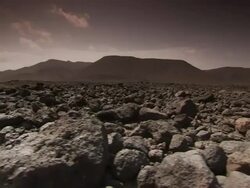 Long Shot tracking-left - Volcanic rock covers a vast lava field. / Djibouti Stock Footage