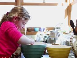 MS Shot of mother and daughter baking together in kitchen / Lamy, New Mexico, United States Stock Footage