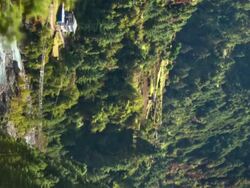 Vertical shot of Time-lapse of a Himalayan valley with a river and a small village. Stock Footage