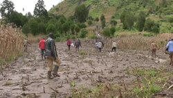 CLEAN : Villagers look for belongings in the mud in landslide hit Kenya News Clip