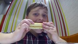 boy eating a sandwich Stock Footage
