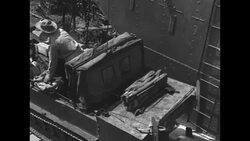 US soldiers with amphibious vehicles on barge floating down river through marsh in 1950s News Clip