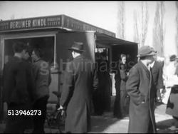 1953: WEST BERLIN MARKET: GERMANY: VS Germans, people, crowded at market, near frankfurter stand (sausage, hot dog), women shopping along market road w/ egg stand, female behind stand picking out eggs, putting them into bag. Berlin Wall Instructional Video