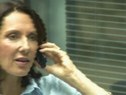 WOman on mobile phone in office, UK Stock Footage