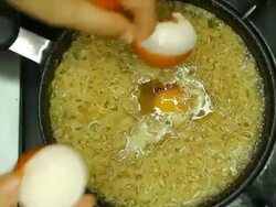 Add the eggs in pot Stock Footage