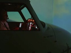 TS WS pilots and instructor in professional flight simulator during flight, external view, RED R3D 4K Stock Footage
