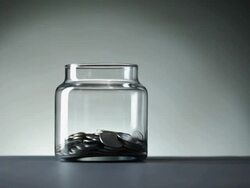 Man saving money into a container  Stock Footage