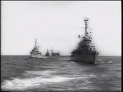 B/W 1962 REAR boat point of view of military ships on ocean / Cuban Missile Crisis / newsreel Stock Footage