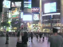 WS T/L View of busy street and pedestrian traffic near Shibuya station at night / Shibuya, Tokyo, Japan Stock Footage