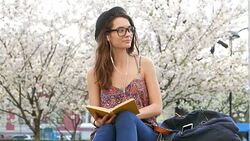 Young girl reading a book Stock Footage