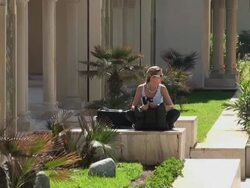 Tourist woman resting in Hassan II Mosque gardens, Casablanca Stock Footage