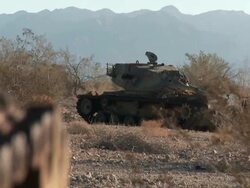 WS Broken down tank in the desert Stock Footage