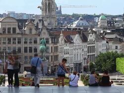 People Relaxing on the Mont des Arts (Mount of the Arts) in Front of the Old Town of Brussels  Stock Footage