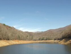 MS AERIAL Shot of Nantahala river flowing through wooded area with trees covered mountain / North Carolina, United States Stock Footage