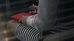 Woman tugging at her notepad nervously Stock Footage