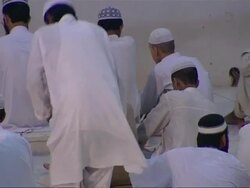 Muslim men at prayer in religious school News Clip