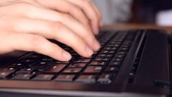 man hand typing on laptop computer keyboard Stock Footage