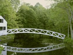 MS Beautiful lonely isolated curved bridge over water in forest / Somesville, Vermont, United States Stock Footage