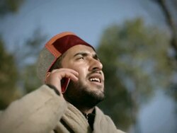 People of Himachal Pradesh: Happy young man talking on phone Stock Footage
