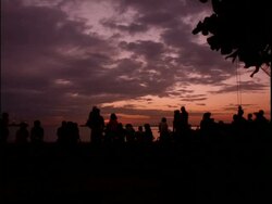 WA silhouetted group of people watching the sunset, Manila Bay, Philippines Stock Footage