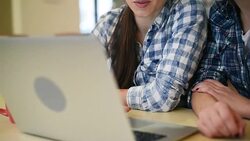 Two beautiful girls with laptop Stock Footage