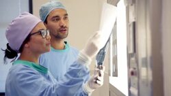 Surgeons discussing MRI scans Stock Footage