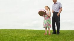 Girl and her Grandfather releasing a helium balloon into the sky Stock Footage