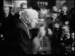 B/W 1965 Charlie Chaplin + Sophia Loren surrounded by photographers at press conference / London Stock Footage