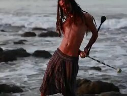 MS TS Rasta man spinninig poi balls with ocean / Montezuma, Punteranes, Costa Rica Stock Footage