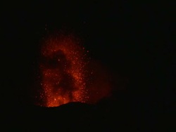 Lava fountains high into sky from erupting volcano at night, Stromboli, Italy. March 2010 Stock Footage