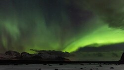 Northern Lights over the frozen Arctic fjord Stock Footage