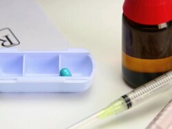 HD Placing pills in box beneath Rx close-up Stock Footage