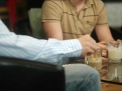 Guys and girl talking at coffee shop Stock Footage
