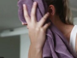 woman toweling off after working out Stock Footage