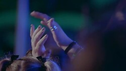 Girl with pigtails claps hands for band at outdoor concert in slow motion Stock Footage