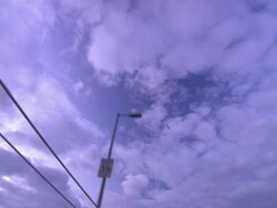 Clouds float over a suspension bridge. Stock Footage