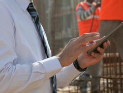 Architect talking on a mobile phone, Delhi, India Stock Footage