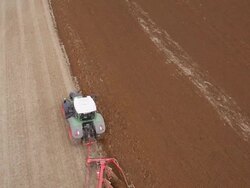 Aerial view of Tractor Ploughing Stock Footage