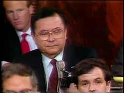 July, 1987 Senator Daniel Inouye talking into microphone then standing during Iran-Contra hearings Stock Footage