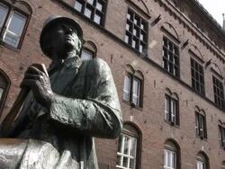 MS View of HC Anderson statue and building with people / Copenhagen, Denmark Stock Footage