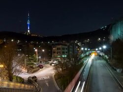 WS T/L View of Nightscape and Traffic moving at near the N Seoul Tower(a communication and observation tower located on Namsan Mountain in central Seoul, South Korea) / Seoul, South Korea Stock Footage