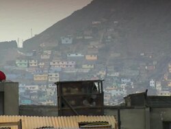 "View over rooftops to part of San Cristobal slum, Hill San Cristobal [Cerro San CristÃƒÂ³bal], cloudy day, Lima, Peru [PerÃƒÂº]" Stock Footage