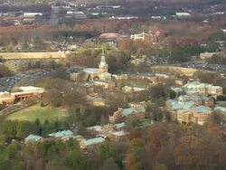 WS AERIAL View of clock tower with Old Salem at Winston Salem / North Carolina, United States Stock Footage