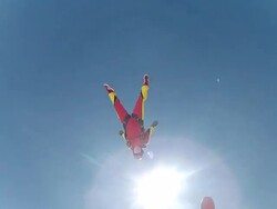 Woman sky diver performs acrobatic mid-air stunts Stock Footage