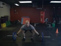 Camera tracks in from wide to close-up as Dustin performs series of snatches. Stock Footage